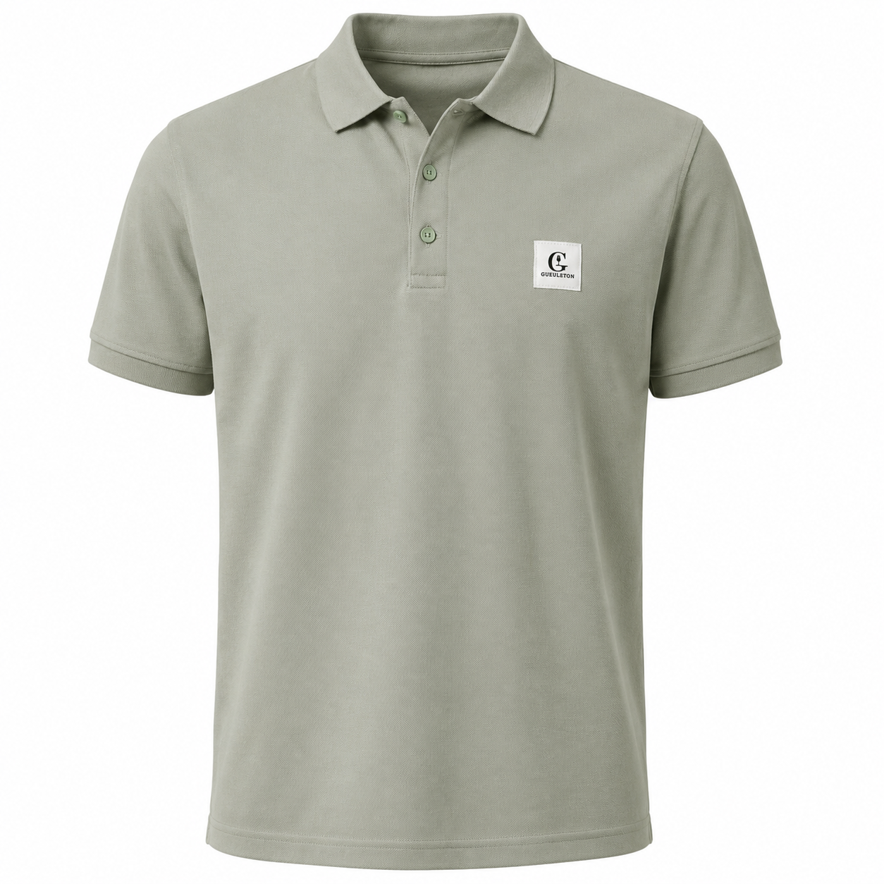 Polo piqué vert sauge Gueuleton 220g, col chemise, boutons sauge assortis, patch tissé blanc logo G Gueuleton poitrine gauche